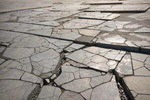 Mudjacking Concrete- Concrete Sidewalk showing damage in Long Island