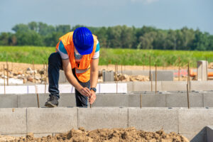 Concrete replacement - Construction worker drilling concrete
