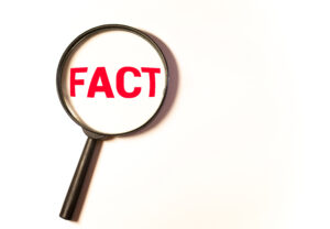 Mudjacking myths- A magnifying glass zooming the word, “FACT”