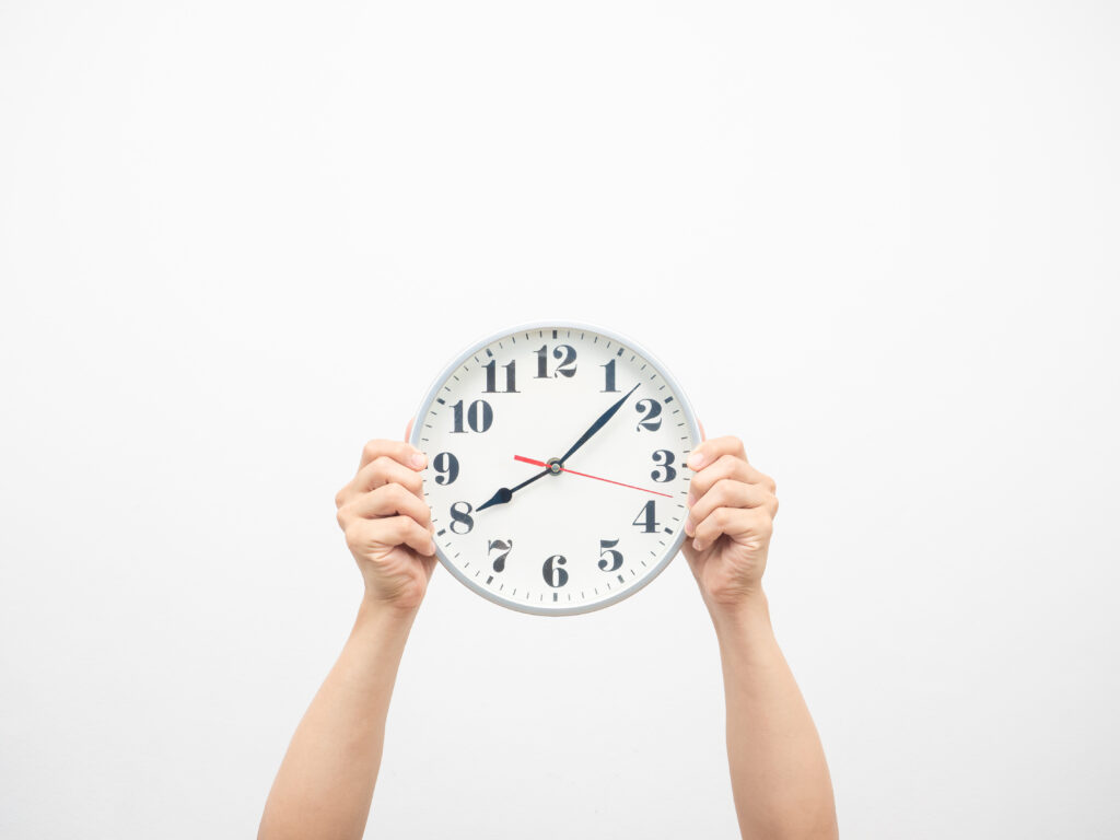 How Long Does Mudjacking Last - A Man Holding a Clock Up in the Air with Two Hands