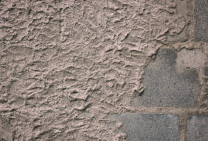 A concrete surface in grey in dire need of resurfacing