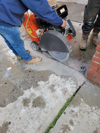 Mudjacking in progress on a concrete slab by the zavza team