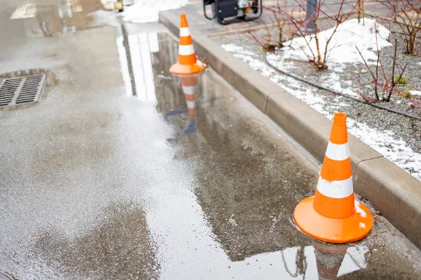 Commercial Parking Lot Repair Services - A Parking Lot Holding Water