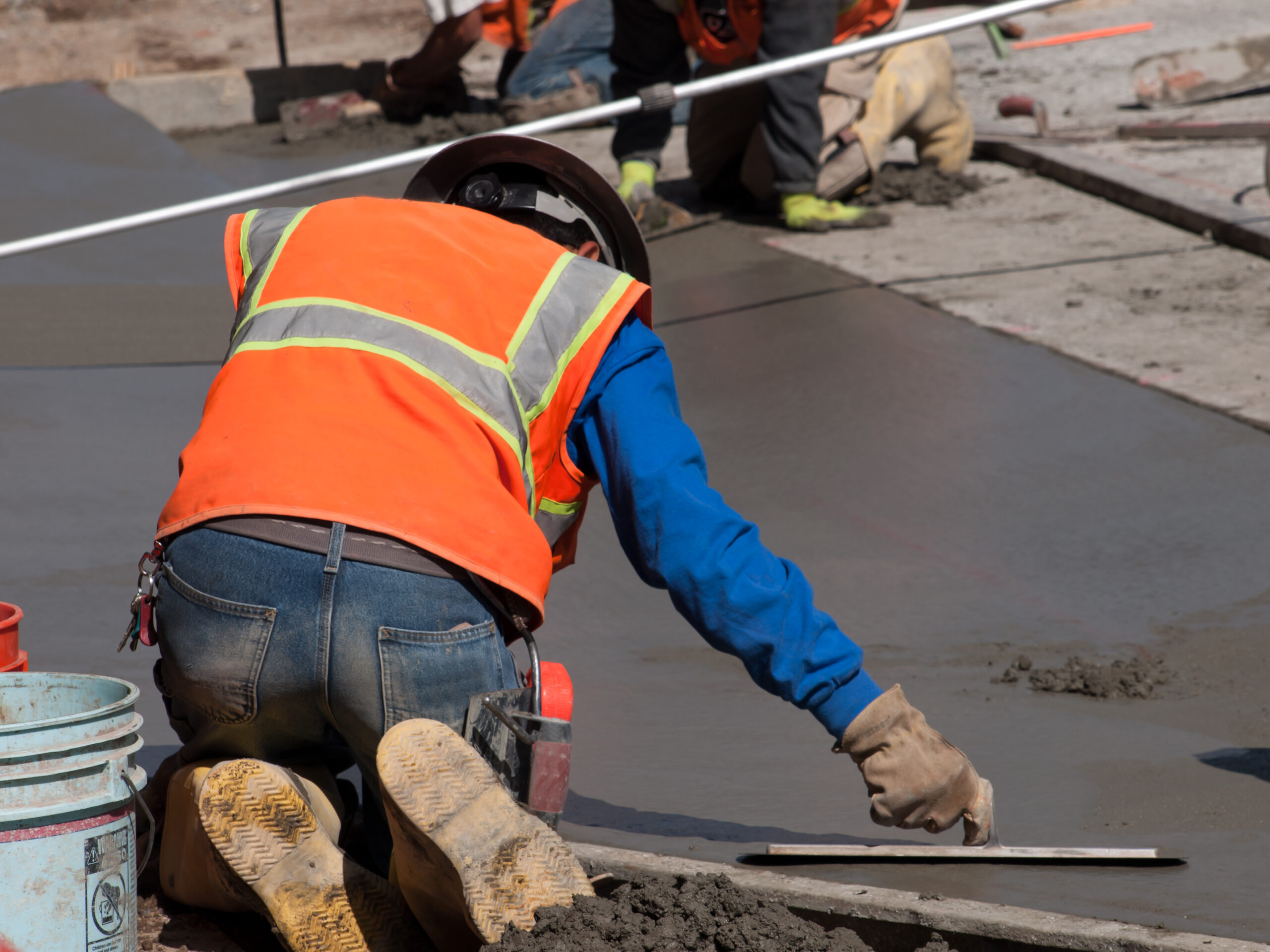 A contractor working on maintaining concrete for a property in NYC.